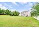 Expansive backyard featuring lawn and trees at 9641 Bellamy Nw Pl, Concord, NC 28027