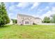 Spacious backyard featuring a large grassy area, perfect for outdoor activities and relaxation at 9641 Bellamy Nw Pl, Concord, NC 28027