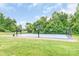 Outdoor basketball court with multiple hoops, providing a recreational space for residents at 9641 Bellamy Nw Pl, Concord, NC 28027