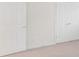 Bedroom featuring neutral carpet, a closet, and a door at 9641 Bellamy Nw Pl, Concord, NC 28027