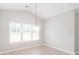 A charming dining room bathed in natural light, perfect for Gathering meals and gatherings at 9641 Bellamy Nw Pl, Concord, NC 28027