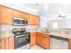 Modern kitchen featuring stainless steel appliances, granite counters and ample cabinetry at 9641 Bellamy Nw Pl, Concord, NC 28027