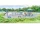 A colorful community playground featuring slides, swings, and other play structures, with a pool in the background at 9641 Bellamy Nw Pl, Concord, NC 28027