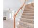 View of the staircase and the living room with a fireplace at 9641 Bellamy Nw Pl, Concord, NC 28027