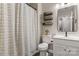 Cozy bathroom with a shower and tasteful decor with decorative shelves above the commode at 9651 Bailey Rd, Cornelius, NC 28031
