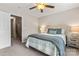 Comfortable bedroom with ceiling fan, carpet floors, and cozy bed at 9651 Bailey Rd, Cornelius, NC 28031