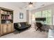 Bedroom with a comfortable black futon, desk and chair with built-in shelving at 9651 Bailey Rd, Cornelius, NC 28031