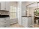 Kitchen with white cabinetry, granite counters, view of dining, and modern flooring at 9651 Bailey Rd, Cornelius, NC 28031