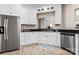 Kitchen featuring white cabinetry, stainless steel appliances, and dark countertops at 9651 Bailey Rd, Cornelius, NC 28031