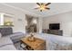 Living room with bar seating, a ceiling fan, and carpet flooring at 9651 Bailey Rd, Cornelius, NC 28031