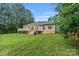 House with deck and fenced-in yard surrounded by trees at 105 Stumpy Creek Rd, Mooresville, NC 28117