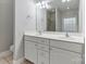Elegant bathroom featuring a double vanity and tiled shower with plenty of natural light at 105 Stumpy Creek Rd, Mooresville, NC 28117