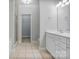 Bright bathroom features tile flooring, walk-in shower, and large vanity with modern fixtures at 105 Stumpy Creek Rd, Mooresville, NC 28117