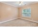Neutral bedroom with carpet, ceiling fan, window, and crown molding at 105 Stumpy Creek Rd, Mooresville, NC 28117