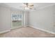 Bedroom with carpet and a large window at 105 Stumpy Creek Rd, Mooresville, NC 28117