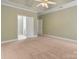 Spacious bedroom featuring neutral tones, a ceiling fan, and an ensuite bathroom at 105 Stumpy Creek Rd, Mooresville, NC 28117
