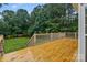 Large wooden deck overlooking a grassy lawn and trees at 105 Stumpy Creek Rd, Mooresville, NC 28117