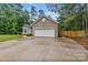 Exterior of the home features a two car garage, a manicured lawn and mature trees at 105 Stumpy Creek Rd, Mooresville, NC 28117