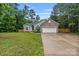 Charming single-story home featuring a brick facade, lush lawn, and attached two car garage at 105 Stumpy Creek Rd, Mooresville, NC 28117