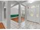 Bright foyer with tile flooring, a decorative front door, and an arched window at 105 Stumpy Creek Rd, Mooresville, NC 28117