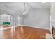 Spacious living area with hardwood floors, a fireplace, and an open layout at 105 Stumpy Creek Rd, Mooresville, NC 28117