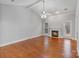 Bright living room with hardwood floors, fireplace, and a view to the back patio at 105 Stumpy Creek Rd, Mooresville, NC 28117