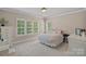 Inviting bedroom with large windows, carpet and light, neutral colors at 117 Walking Horse Trl, Davidson, NC 28036