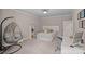 Cozy bedroom featuring a hanging chair and a comfortable bed at 117 Walking Horse Trl, Davidson, NC 28036