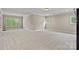 Bright bonus room featuring plush carpet and an abundance of natural light at 117 Walking Horse Trl, Davidson, NC 28036