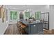 Modern kitchen featuring an expansive island with barstool seating at 117 Walking Horse Trl, Davidson, NC 28036