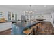 Modern kitchen featuring an expansive island and pendant lighting at 117 Walking Horse Trl, Davidson, NC 28036