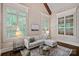 Bright living room featuring plantation shutters, neutral colors, and hardwood floors at 117 Walking Horse Trl, Davidson, NC 28036