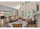 Open-concept living room with soaring ceilings, hardwood floors, and lots of natural light at 117 Walking Horse Trl, Davidson, NC 28036