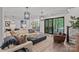 Open-concept living room showcases wood flooring and natural lighting at 117 Walking Horse Trl, Davidson, NC 28036