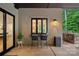 Covered patio with an outdoor kitchen, bar seating, and a view of the green backyard at 117 Walking Horse Trl, Davidson, NC 28036