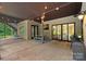 Covered patio with a seating area, string lights, and a view of the landscaped backyard at 117 Walking Horse Trl, Davidson, NC 28036