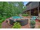 Backyard with a swimming pool, fire pit area, and outdoor seating, ideal for entertaining at 117 Walking Horse Trl, Davidson, NC 28036