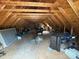 Unfinished attic space with exposed wooden beams showing the potential for future expansion or storage at 13219 Asbury Chapel Rd, Huntersville, NC 28078