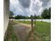Expansive backyard featuring a patio area, green space, and a white fence for added privacy at 13219 Asbury Chapel Rd, Huntersville, NC 28078