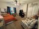 Cozy bedroom with vibrant decor, wall art, a ceiling fan, and ample closet space for storage at 13219 Asbury Chapel Rd, Huntersville, NC 28078