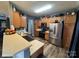 Well-lit kitchen featuring stainless steel appliances, wood cabinets, and a sink with counter space at 13219 Asbury Chapel Rd, Huntersville, NC 28078