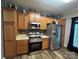 Open kitchen featuring stainless steel appliances, wood cabinets, and plenty of counter space at 13219 Asbury Chapel Rd, Huntersville, NC 28078