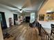 Bright living room showcasing hardwood floors, an open floor plan, and lots of natural light from the windows at 13219 Asbury Chapel Rd, Huntersville, NC 28078