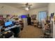 Home office with a workstation, file cabinets, and a window for natural light perfect for a productive environment at 13219 Asbury Chapel Rd, Huntersville, NC 28078