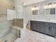 Modern bathroom featuring a glass enclosed shower, a double vanity, and updated lighting at 1326 Crown Ridge Dr, Fort Mill, SC 29708