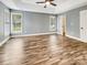 Bedroom with tray ceiling, ceiling fan, and two windows at 1326 Crown Ridge Dr, Fort Mill, SC 29708