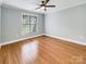 Bedroom with hardwood flooring, ceiling fan, and natural light at 1326 Crown Ridge Dr, Fort Mill, SC 29708