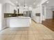 Bright kitchen with white cabinetry, tile flooring, and island at 1326 Crown Ridge Dr, Fort Mill, SC 29708