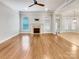 Spacious living room with fireplace, hardwood floors, and lots of natural light at 1326 Crown Ridge Dr, Fort Mill, SC 29708