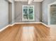 Inviting living room with large window, wood floors and natural light at 1326 Crown Ridge Dr, Fort Mill, SC 29708